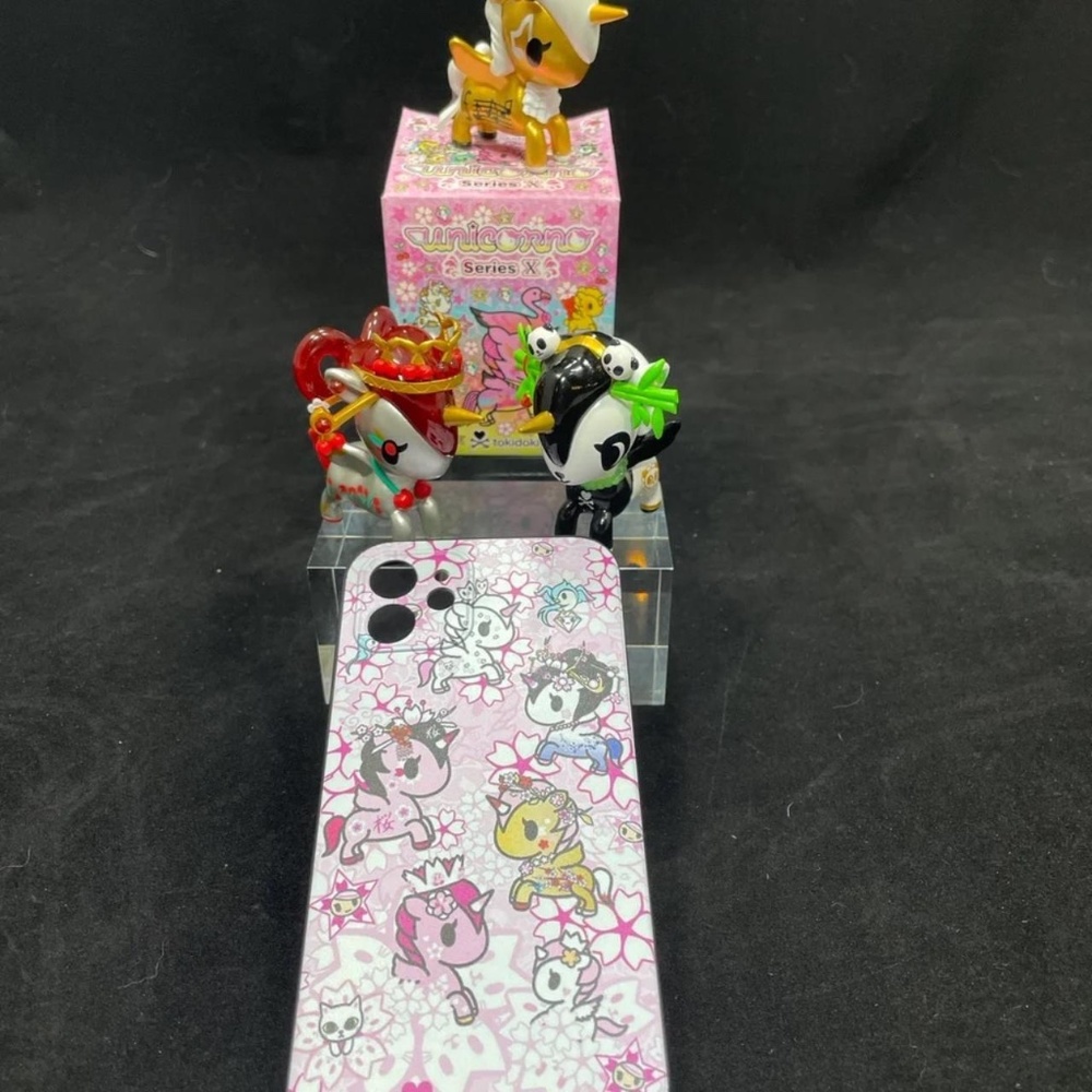Flexible Tokidoki phone cover featuring cherry blossoms. Fits iPhone12